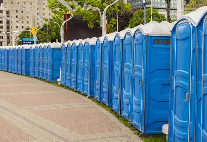 hygienic portable restrooms lined up at a music festival, providing comfort and convenience for attendees in Atlanta, GA